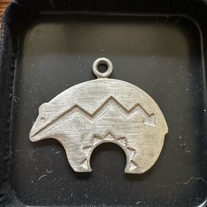 Huge Native American style pendant! I think it’s pewter.